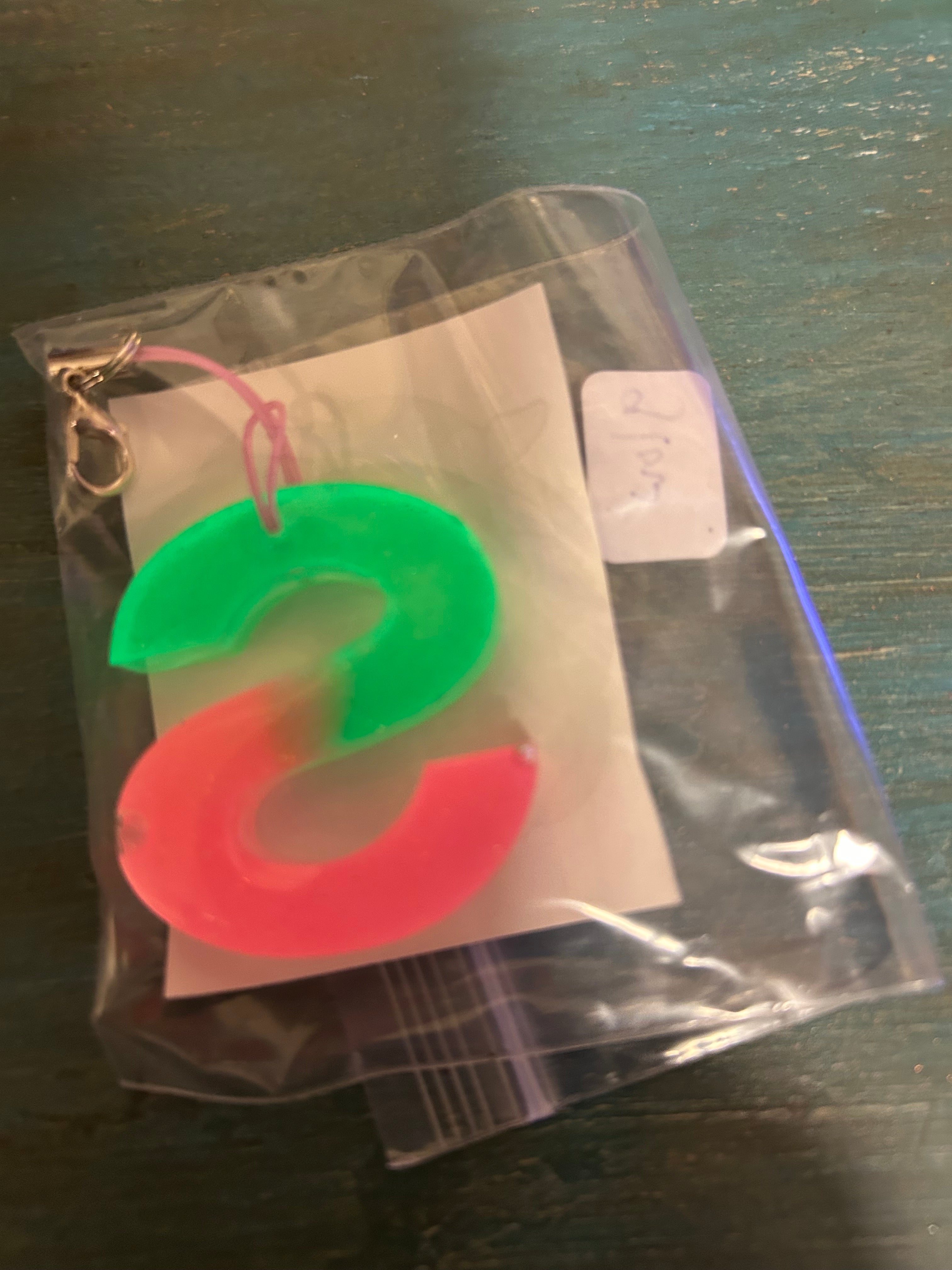 Letter charms/key chains/ bag clips (style color varies) some glow some don’t