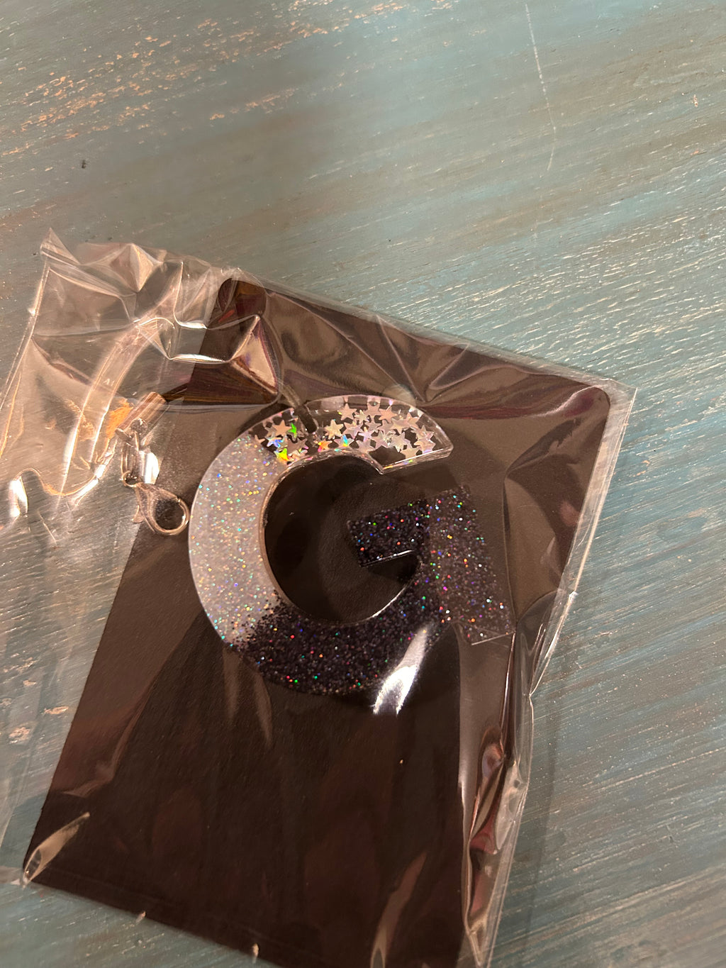 Letter charms/key chains/ bag clips (style color varies) some glow some don’t