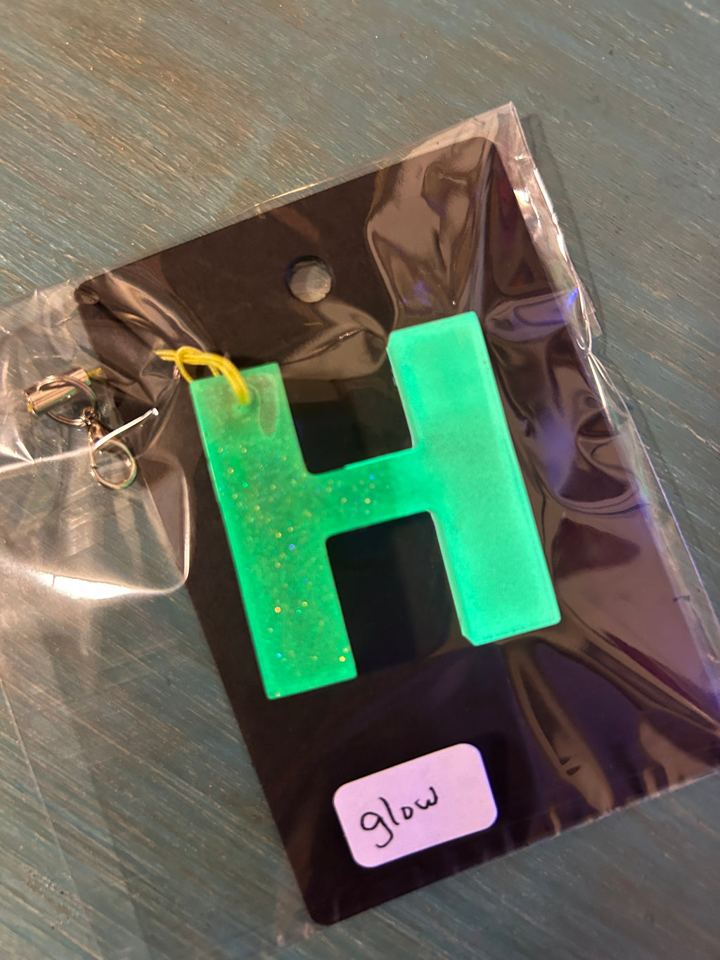 Letter charms/key chains/ bag clips (style color varies) some glow some don’t