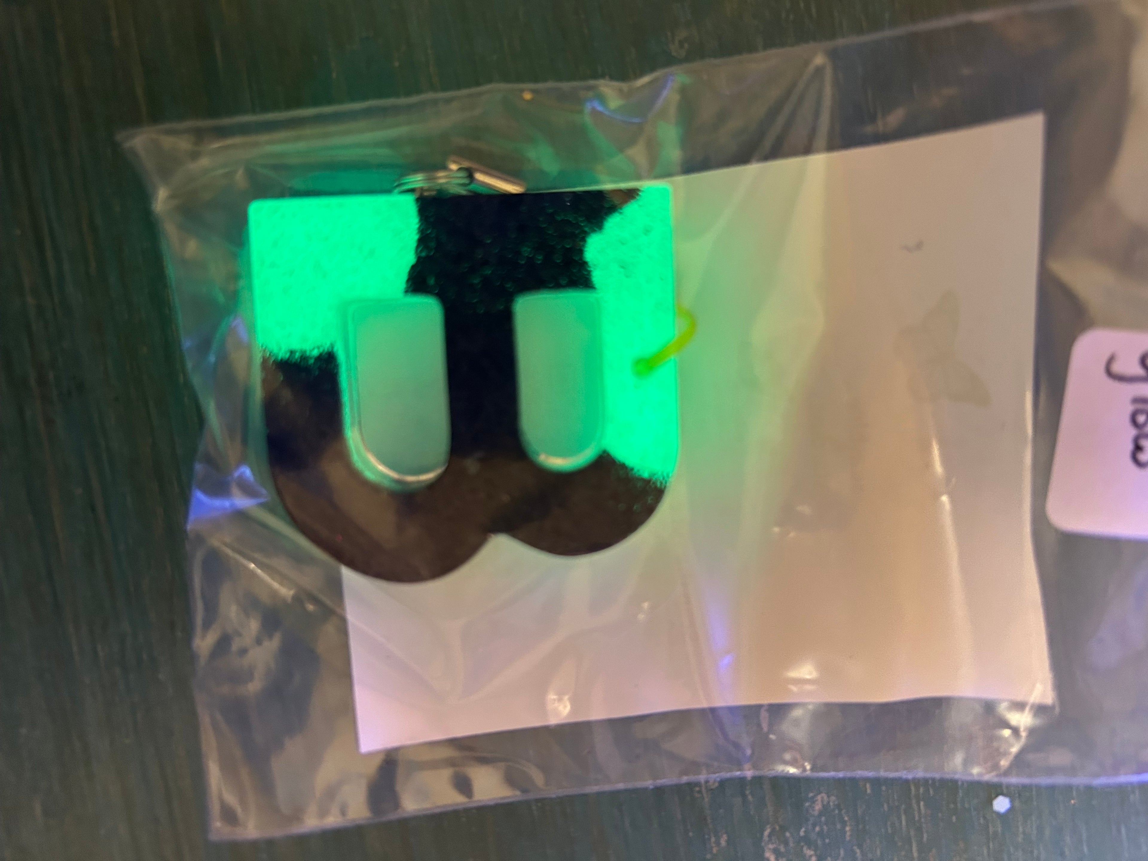 Letter charms/key chains/ bag clips (style color varies) some glow some don’t