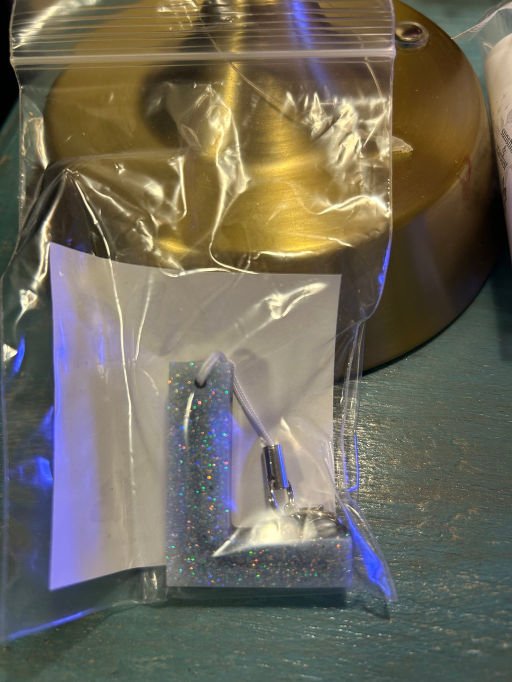 Letter charms/key chains/ bag clips (style color varies) some glow some don’t