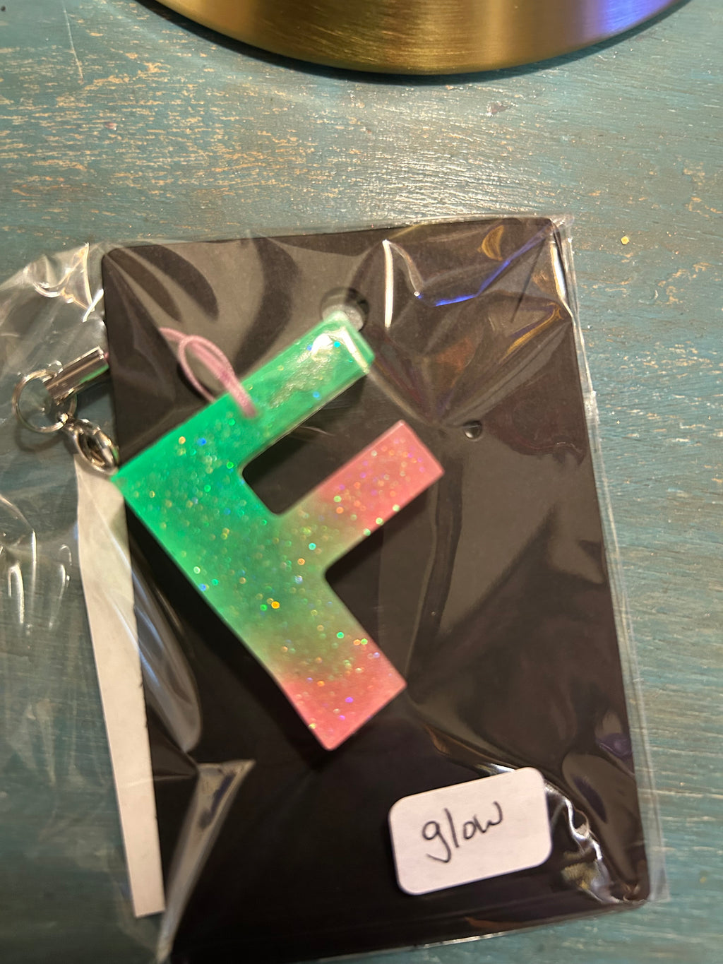 Letter charms/key chains/ bag clips (style color varies) some glow some don’t