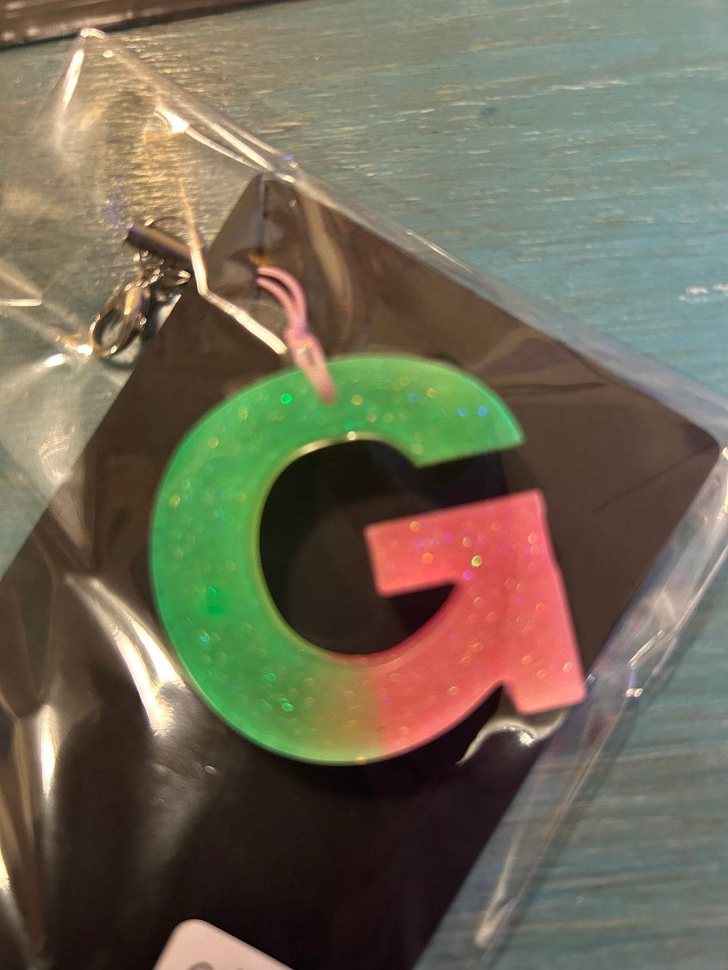 Letter charms/key chains/ bag clips (style color varies) some glow some don’t