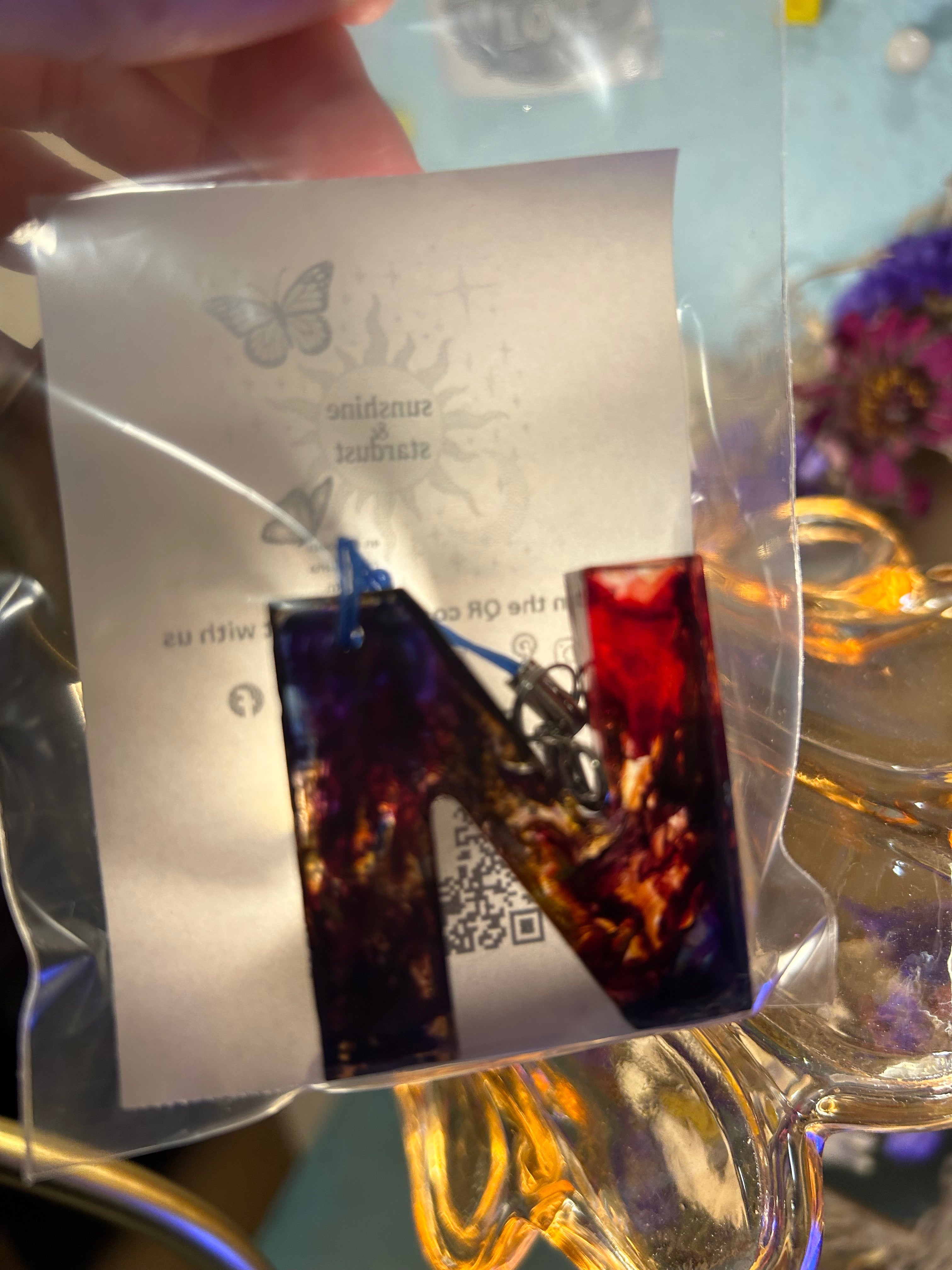 Letter charms/key chains/ bag clips (style color varies) some glow some don’t