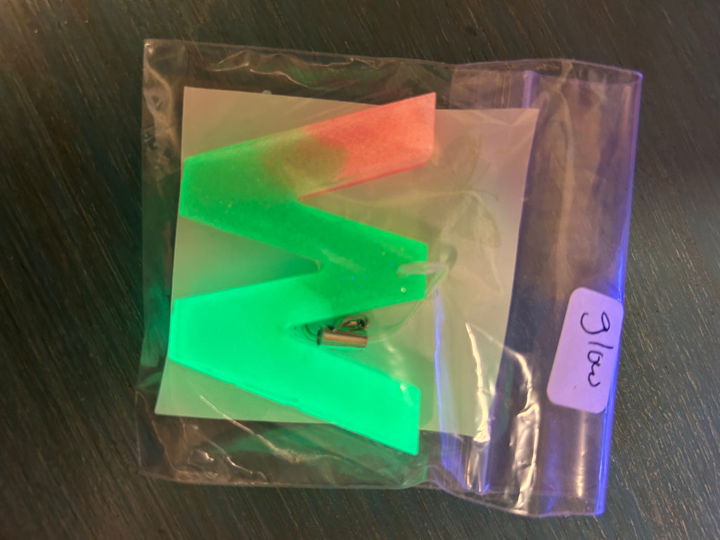 Letter charms/key chains/ bag clips (style color varies) some glow some don’t