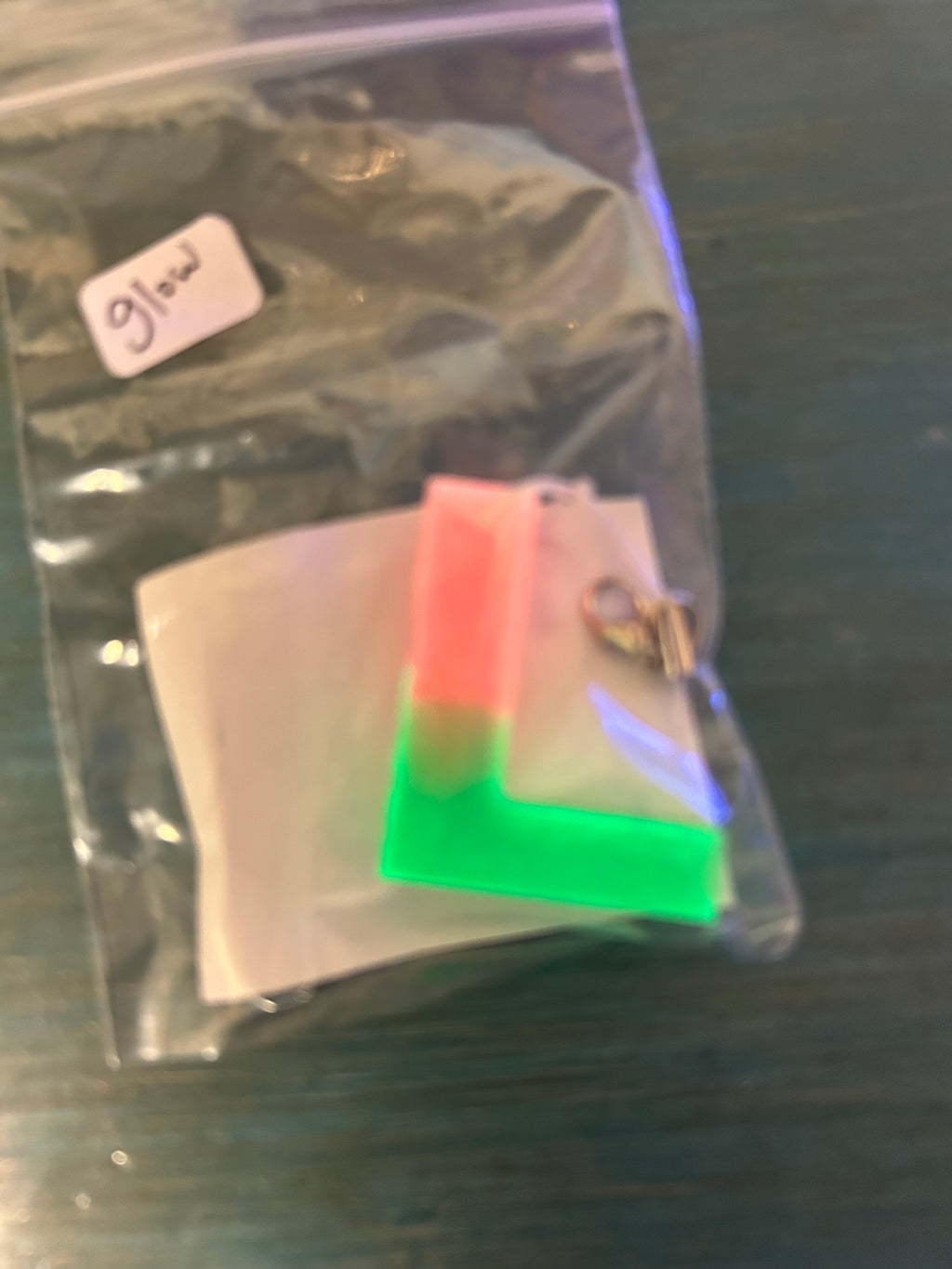 Letter charms/key chains/ bag clips (style color varies) some glow some don’t