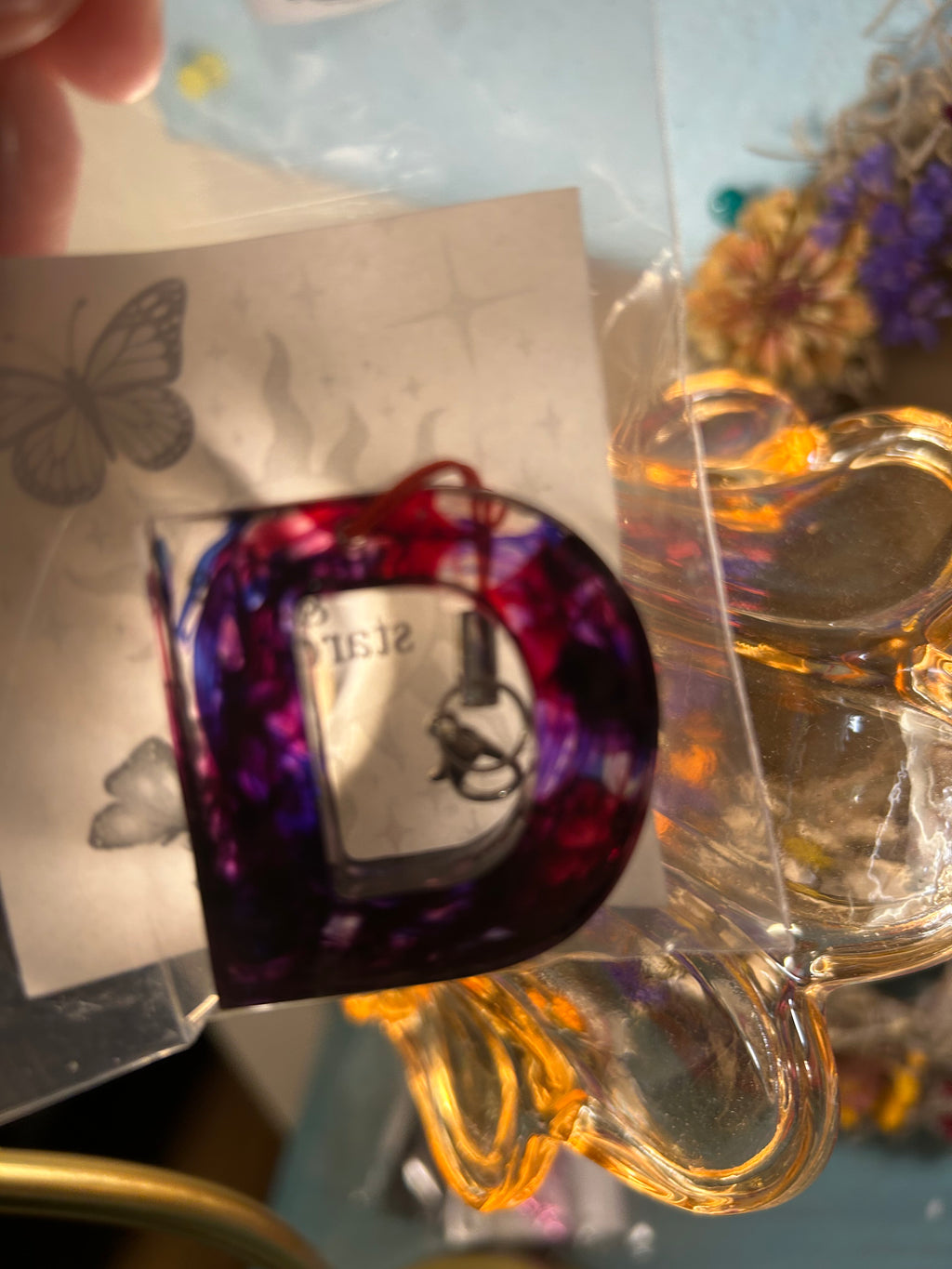 Letter charms/key chains/ bag clips (style color varies) some glow some don’t