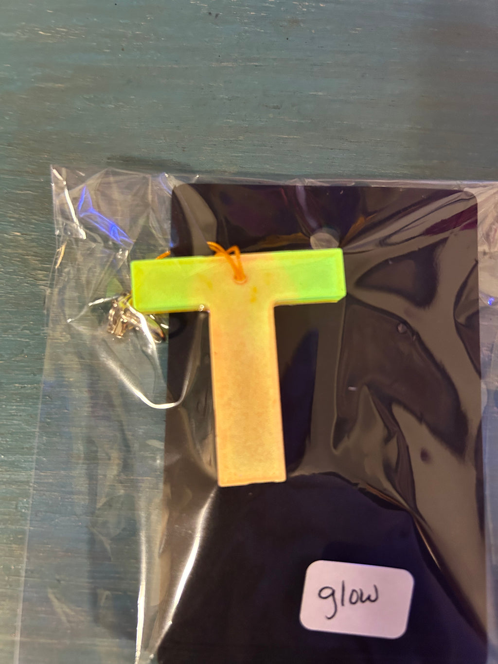 Letter charms/key chains/ bag clips (style color varies) some glow some don’t
