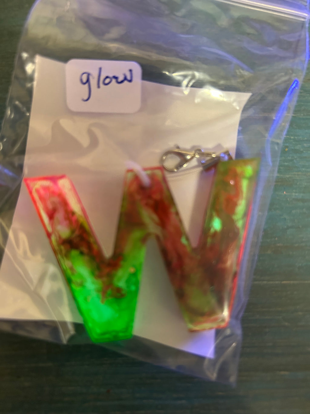 Letter charms/key chains/ bag clips (style color varies) some glow some don’t