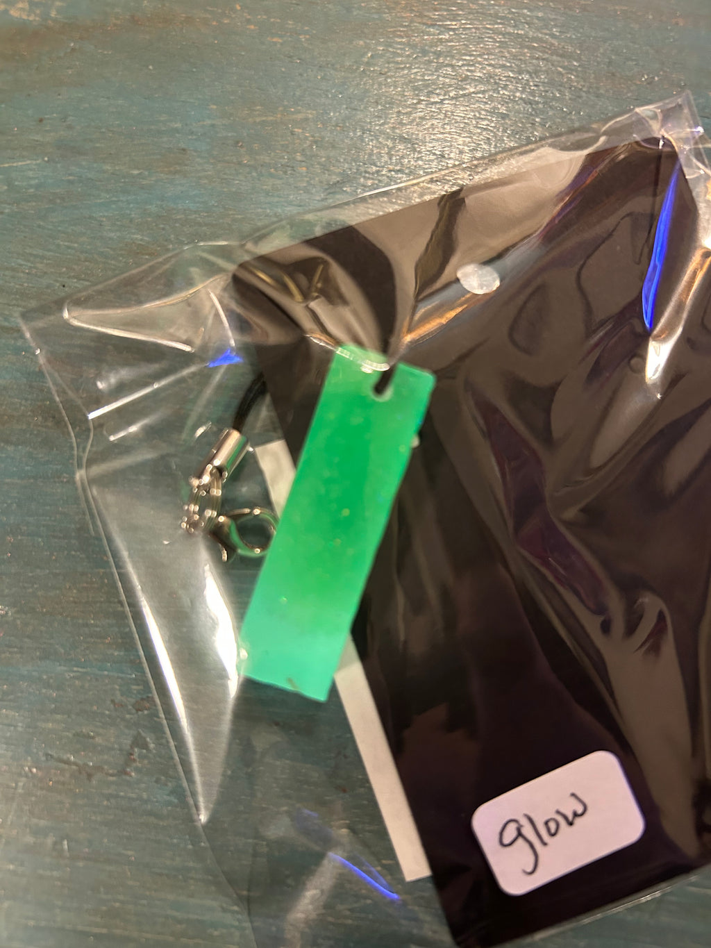 Letter charms/key chains/ bag clips (style color varies) some glow some don’t