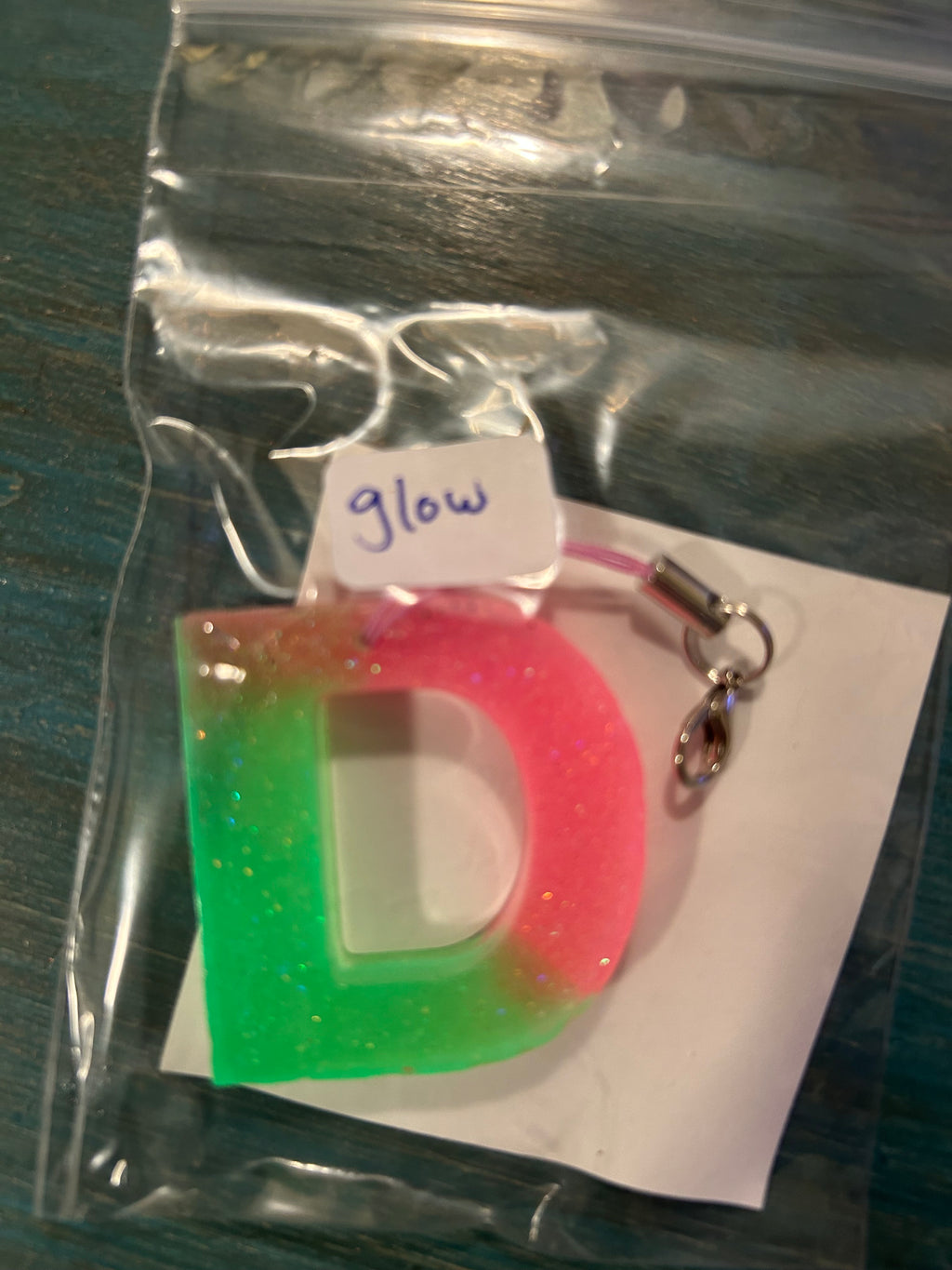 Letter charms/key chains/ bag clips (style color varies) some glow some don’t