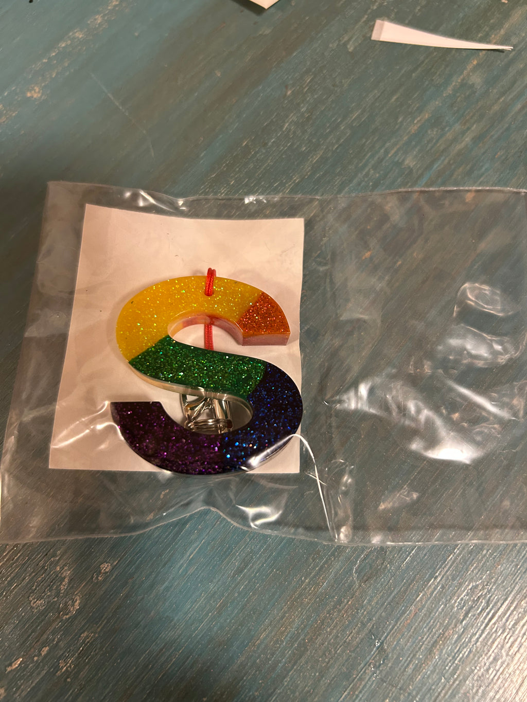 Letter charms/key chains/ bag clips (style color varies) some glow some don’t