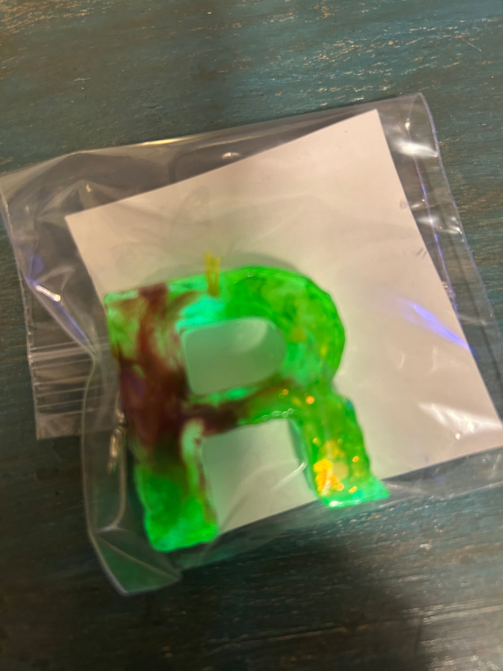 Letter charms/key chains/ bag clips (style color varies) some glow some don’t