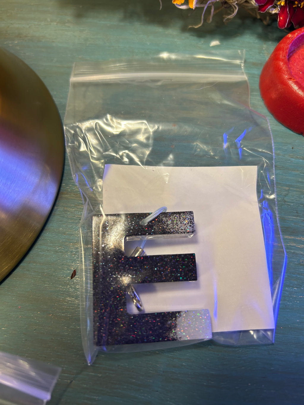 Letter charms/key chains/ bag clips (style color varies) some glow some don’t