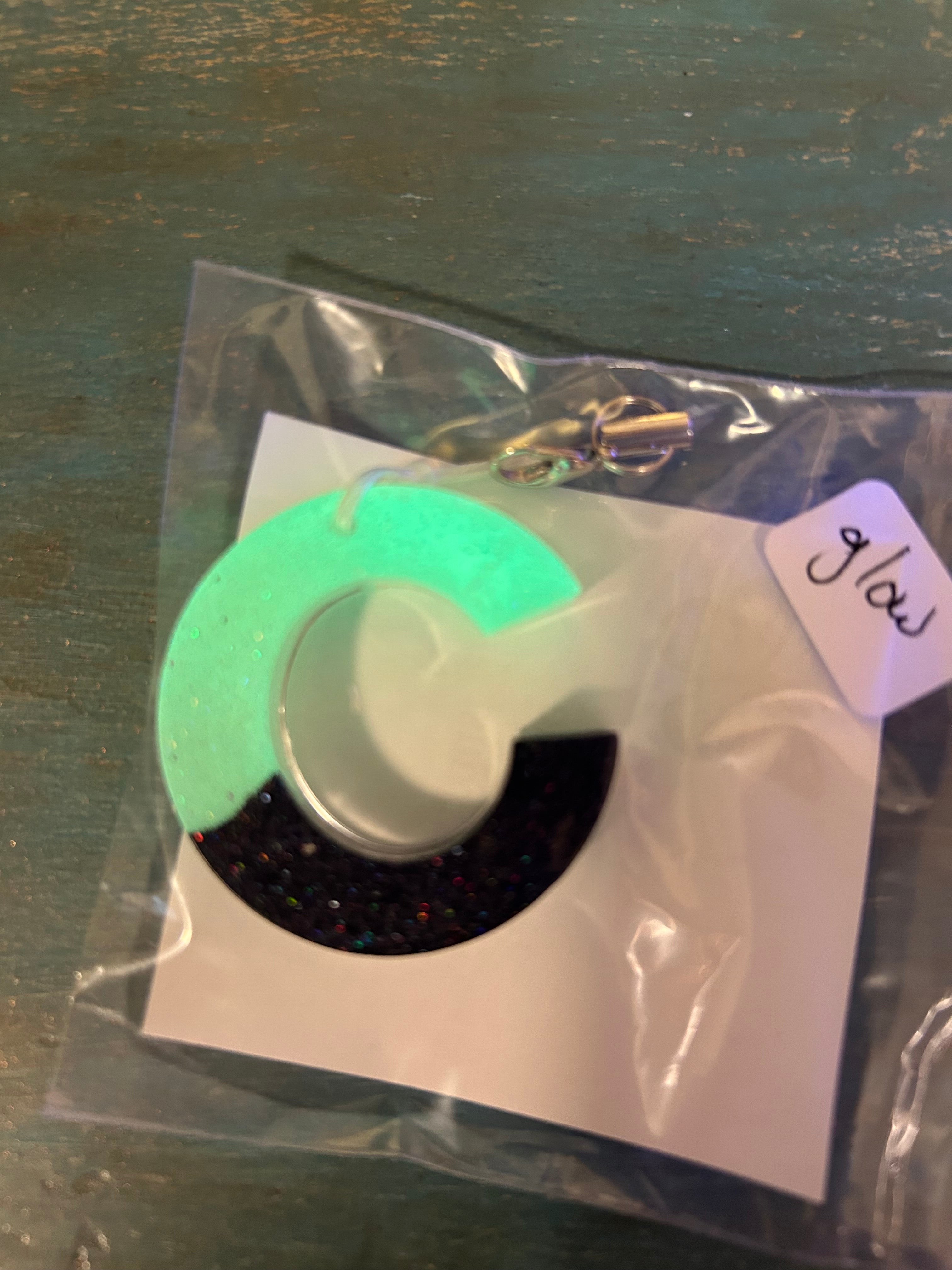 Letter charms/key chains/ bag clips (style color varies) some glow some don’t