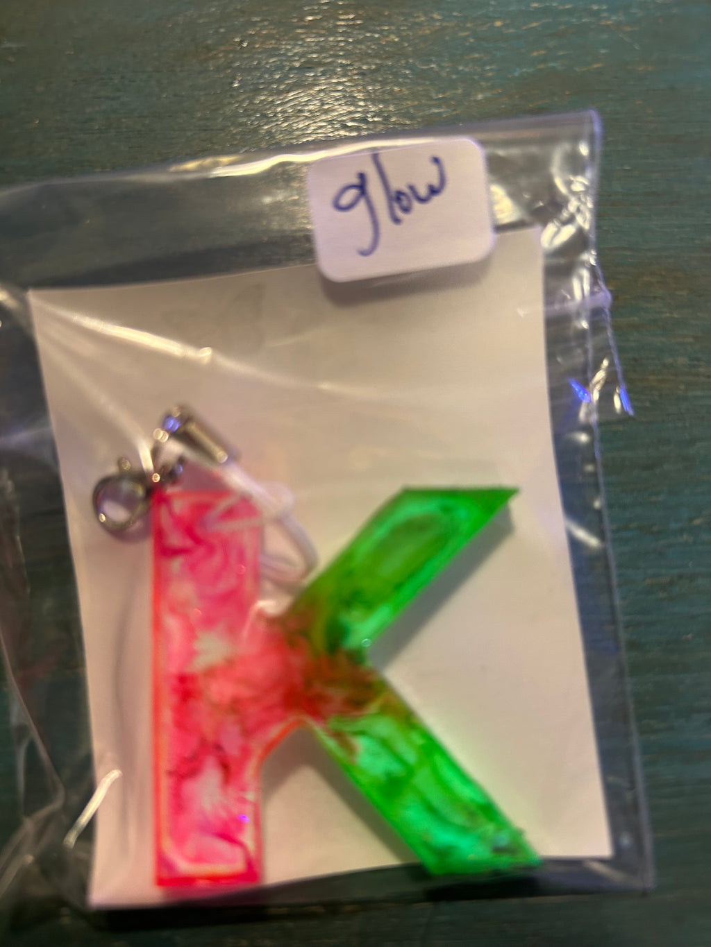 Letter charms/key chains/ bag clips (style color varies) some glow some don’t
