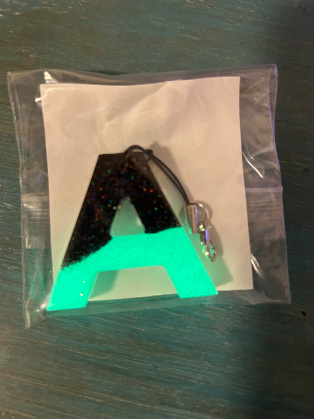 Letter charms/key chains/ bag clips (style color varies) some glow some don’t
