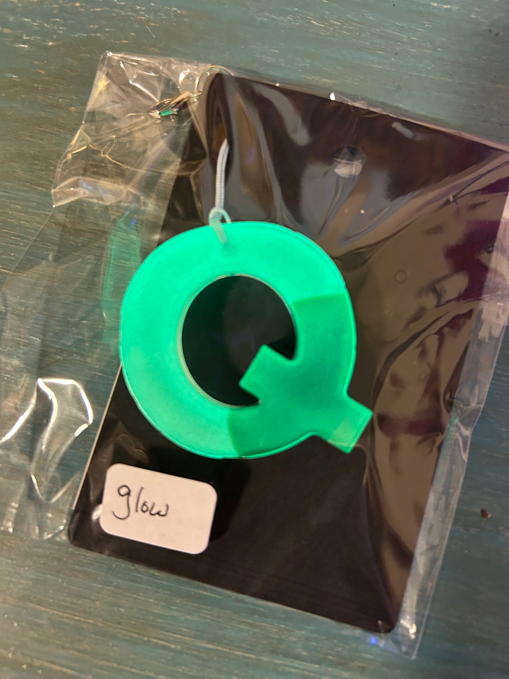 Letter charms/key chains/ bag clips (style color varies) some glow some don’t