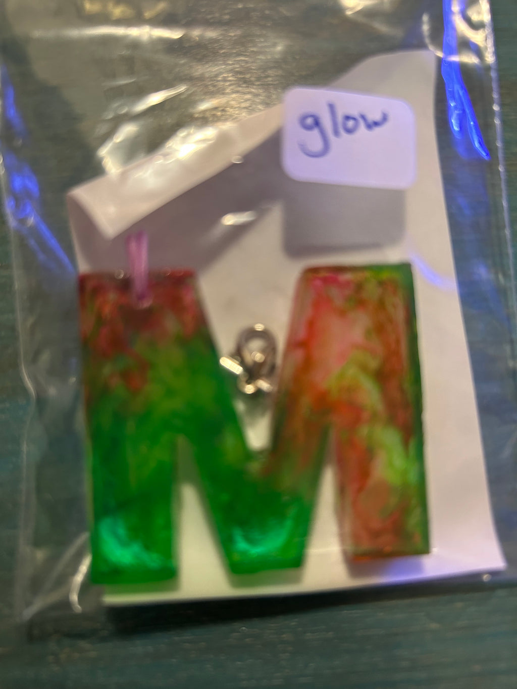 Letter charms/key chains/ bag clips (style color varies) some glow some don’t