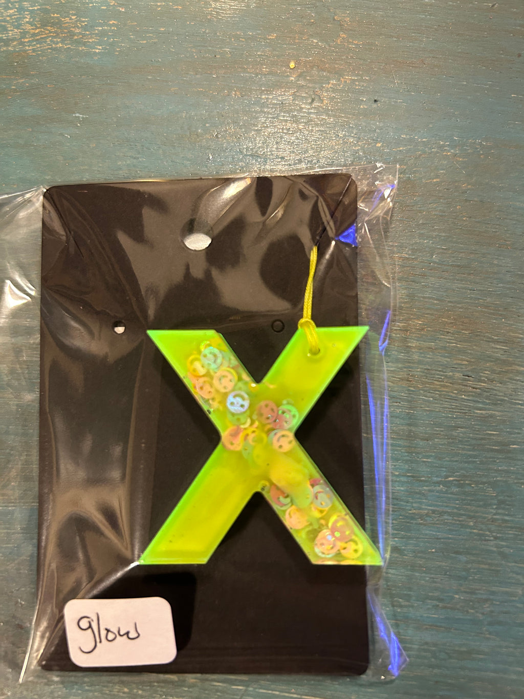 Letter charms/key chains/ bag clips (style color varies) some glow some don’t