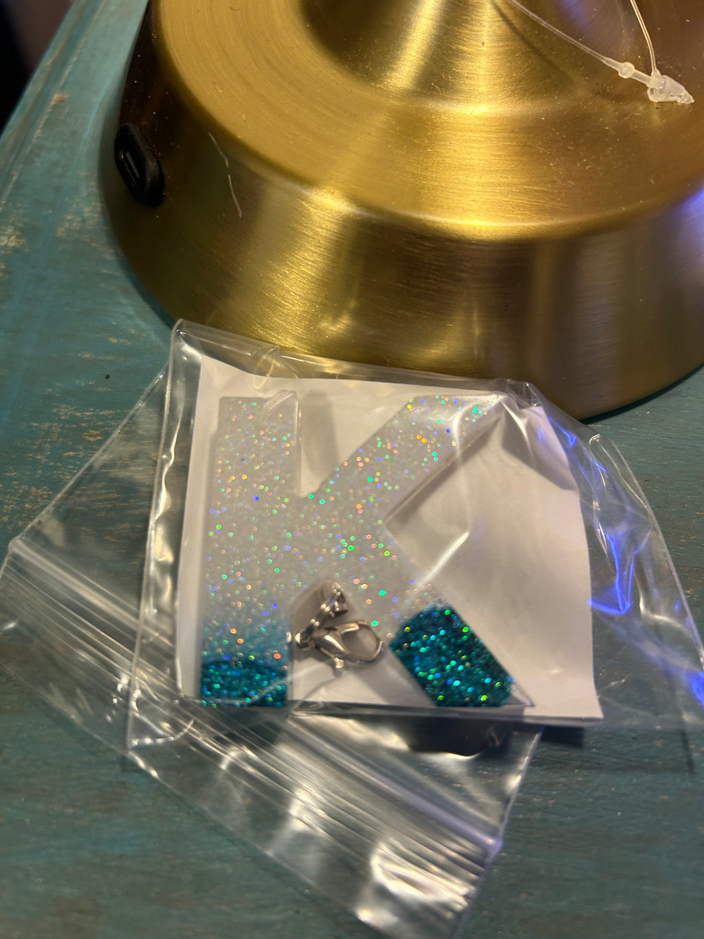 Letter charms/key chains/ bag clips (style color varies) some glow some don’t